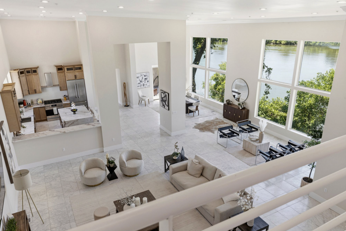 A loft overlooks the open-concept great room and captures views of the Sacramento River at the Garden Highway home northwest of downtown Sacramento.
